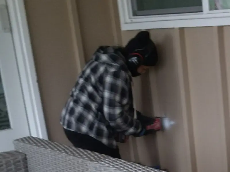 Professional electrician installing an exterior outlet in Berlin